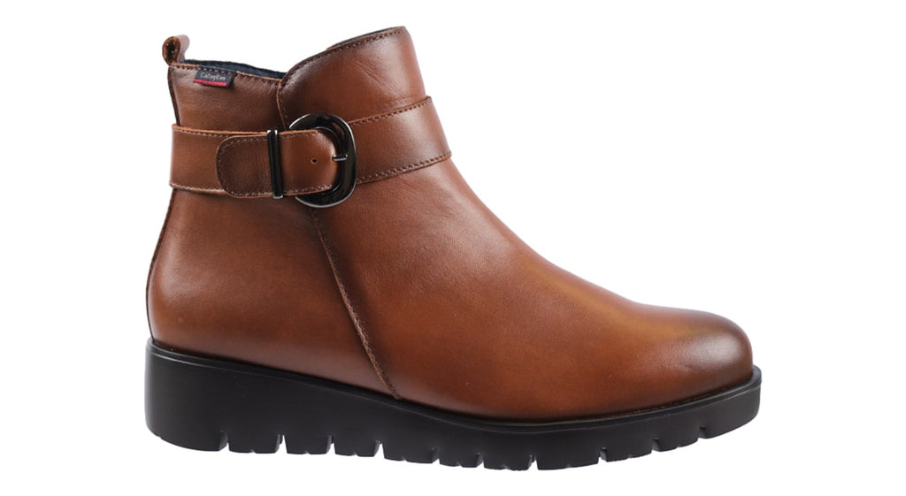 Tan leather flat ankle boot with strap and buckle detailing