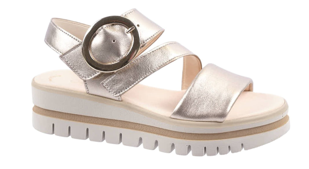 pale gold leather flat sandals with circular buckle