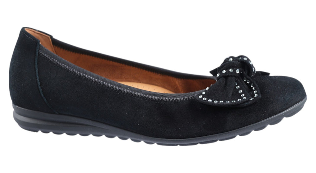 Black suede flat shoe with decorative bow