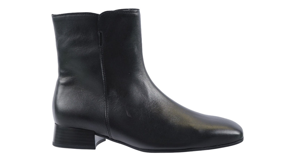 Black soft leather ankle boots with a low heel.