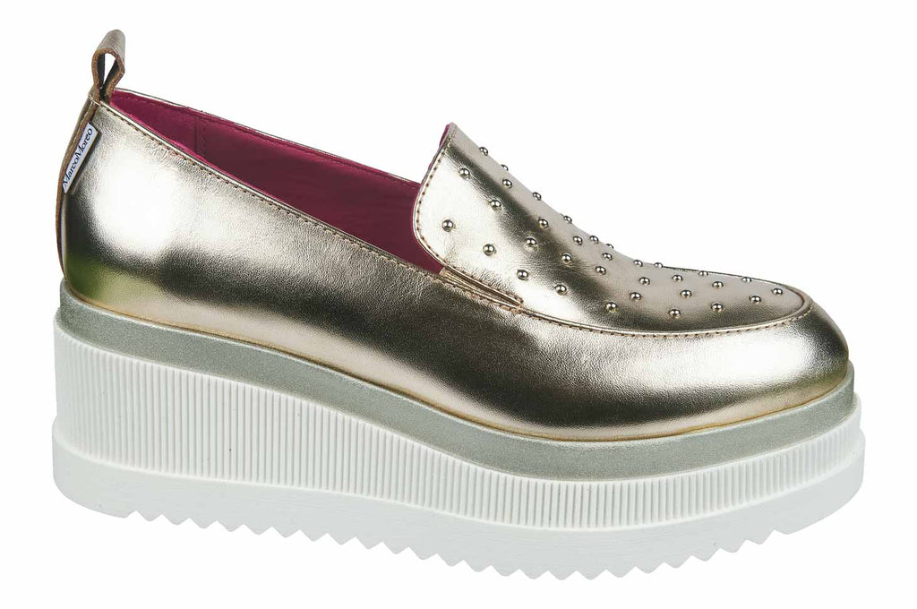Marco Moreo wedge shoes in soft gold on a grey and white sole