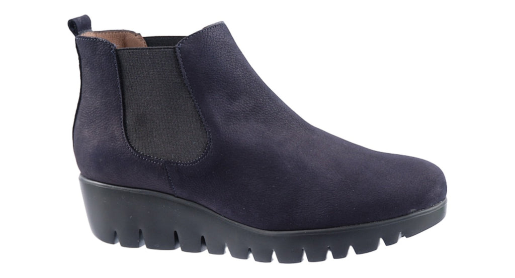Comfy navy suede boot with two elastic side gussets on a super light weight wedge sole.